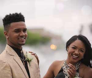 Groom and bride smiling